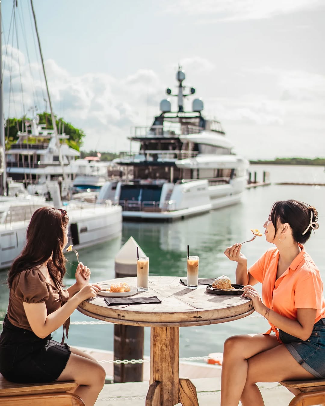 Bali’s All-Set to Become a Prominent Super-Yacht Destination - Two women having coffee with luxury yacht view by instagram @blackstoneyachtclub