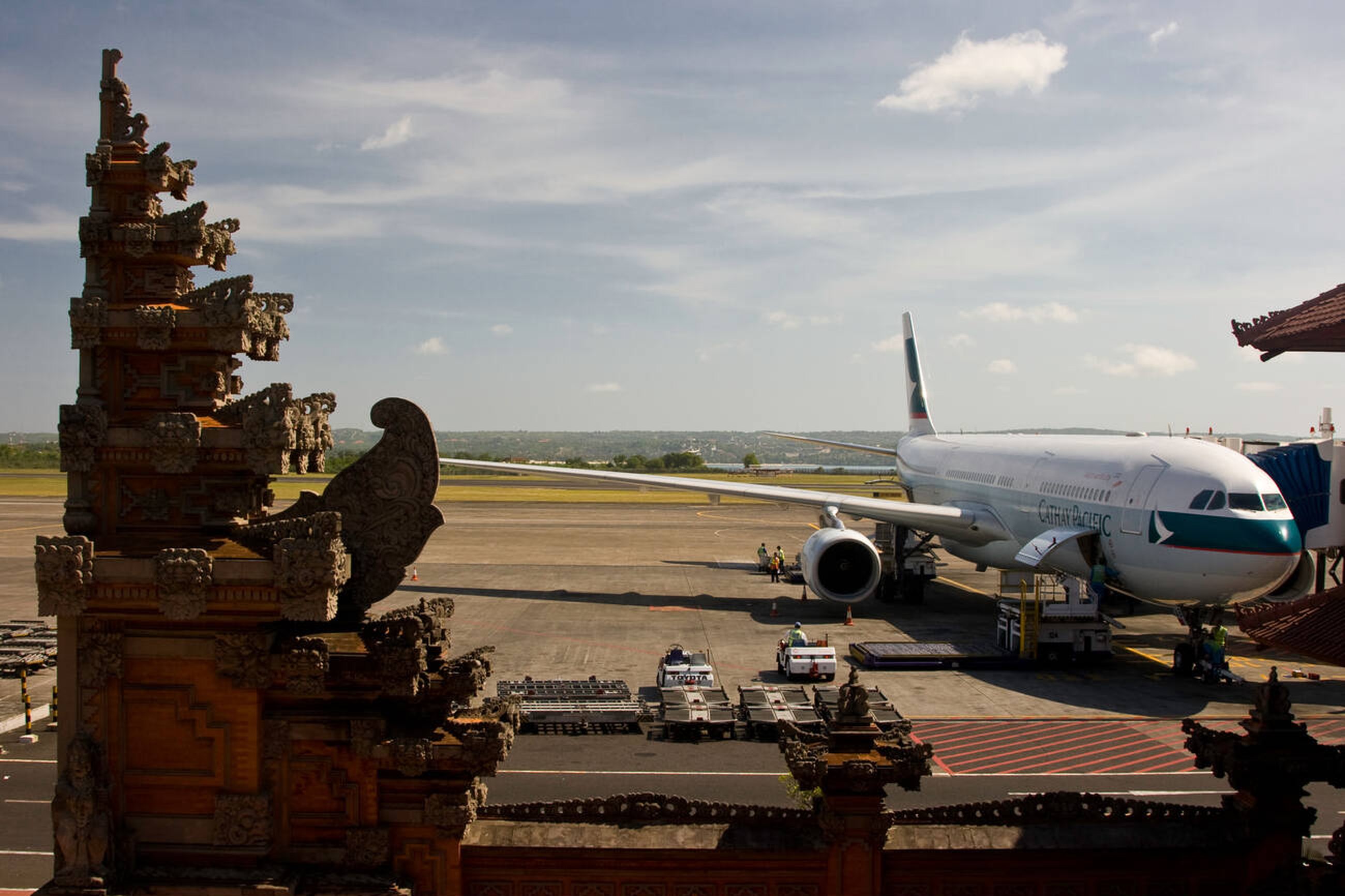 New Low-Cost Flights Make Bali-Lombok Travel Easier Than Ever - Plane in Ngurah Rai Airport Illustration