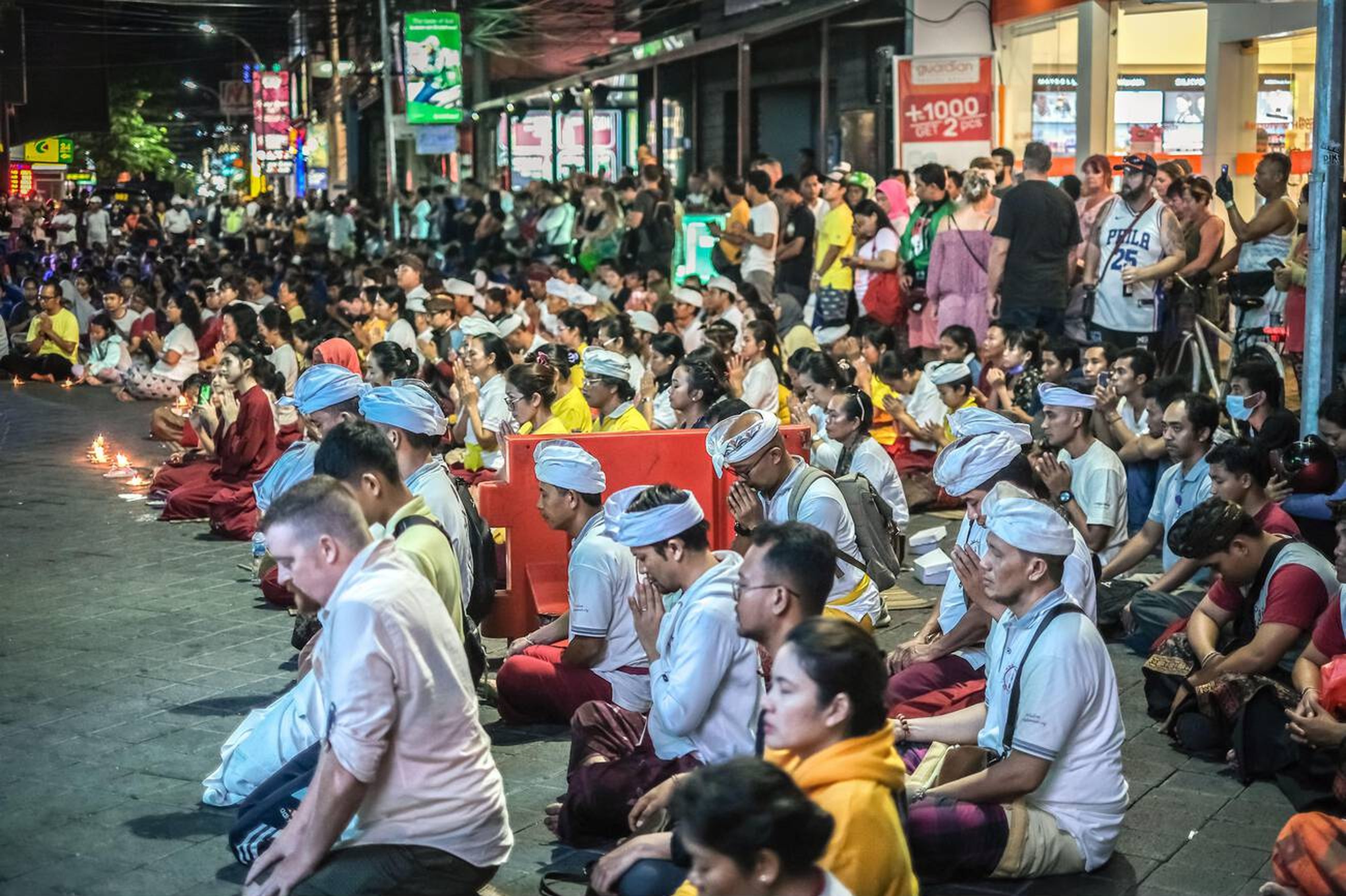 People Praying on Bali Memorial Ground Zero Site